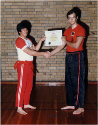 Receiving Lakan Lima, 5th degree black belt Modern Arnis from GM Ernesto Presas